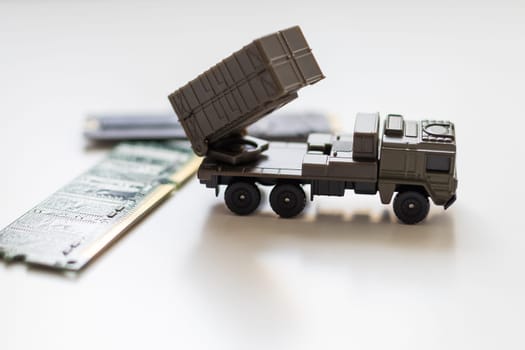 A toy military vehicle with a rocket and microcircuit. High quality photo
