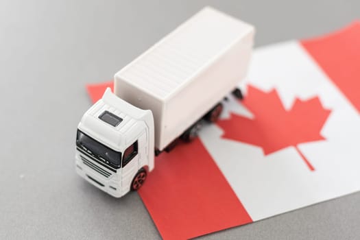 Symbol of National Delivery Truck with Flag of Canada. National Trucking Icon and Canadian flag. High quality photo