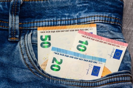 Euro bank notes in a demin jeans pocket