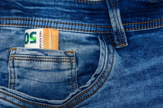 Fifty euro banknotes in blue jeans pocket 3