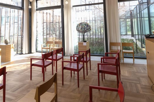 Church room for prayer and privacy with a large cross and chairs for visitors. Herlev hospital, Denmark.
