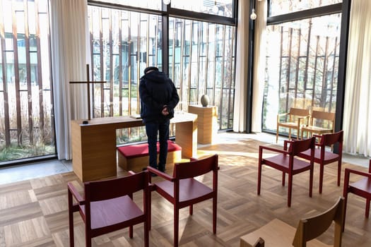 Church room for prayer and privacy with a large cross and chairs for visitors. Herlev hospital, Denmark.