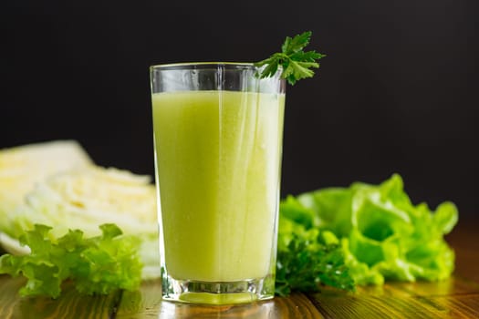 vegetarian smoothie made from green vegetables, cabbage, lettuce, greens .