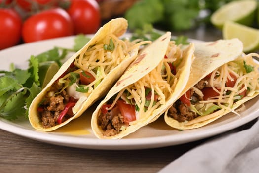 Taco with ground beef and avocado, cabbage and cheese. Mexican cuisine. 