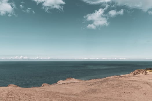 Sand dunes and seascape next to Rubjerg Knude Lighthouse, Denmark.