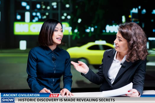 Show hosts reveal historic discovery made by specialists and experts, finding ancient civilization remains. Newscasters team debating historical disclosure on international tv program.