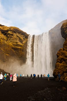 Scandinavian skgafoss waterfall circa March 2023 in iceland with majestic scenery near arctic mountain, nordic landscape. Icelandic nature with large cascade river flow, spectacular highland.