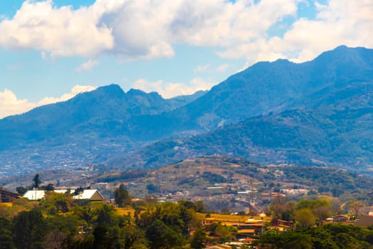 Runway airport and city mountains panorama view from airplane in Rio Segundo Alajuela Costa Rica in Central America.