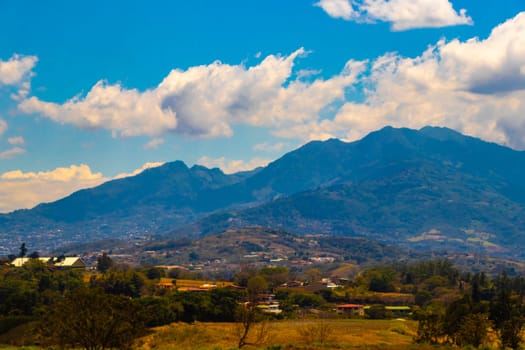 Runway airport and city mountains panorama view from airplane in Rio Segundo Alajuela Costa Rica in Central America.