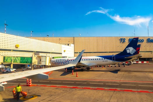 Aircraft at the airport Building and runway Aeropuerto Internacional Benito Juarez in Penon de los Banos Venustiano Carranza Mexico City Mexico.