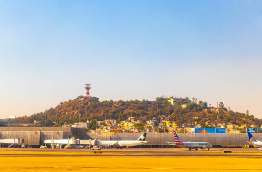 Aircraft at the airport Building and runway Aeropuerto Internacional Benito Juarez in Penon de los Banos Venustiano Carranza Mexico City Mexico.