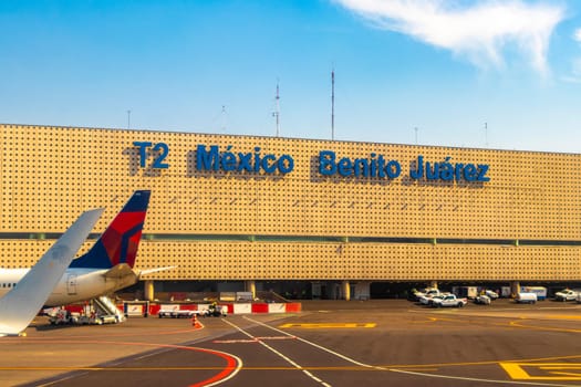 Aircraft at the airport Building and runway Aeropuerto Internacional Benito Juarez in Penon de los Banos Venustiano Carranza Mexico City Mexico.