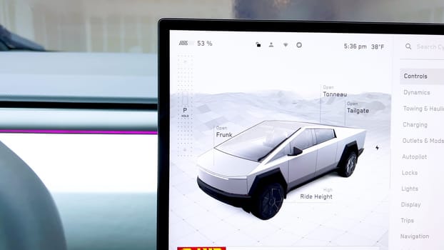 Denver, Colorado, USA-April 28, 2024- Highlighting the Tesla Cybertruck state-of-the-art touchscreen interface, this image shows the detailed control panel that allows drivers to adjust vehicle settings such as ride height, mirror positioning, and more, enhancing the driving experience with modern technology.