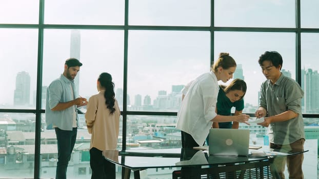 Group of diverse business people brainstorming about marketing plan. Professional multicultural business team working, talking, presenting about financial strategy at modern office. Tracery