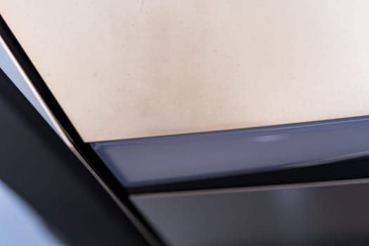 Denver, Colorado, USA-May 5, 2024-This image captures the streamlined and minimalistic design detail of the Tesla Cybertruck exterior, focusing on the sleek and subtle curvature that showcases the futuristic aesthetic of this innovative electric vehicle.