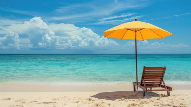 A chair and an umbrella provide shade on the sandy beach, with the azure sky reflecting in the crystal clear water of the oceanic coastal landforms AIG50