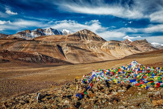 Buddhist prayer flags (lungta) on top of Baralacha La pass on Manali-Leh road. Baralacha La Pass, Himachal Pradesh, India