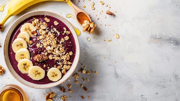 Two bowls of superfood smoothie with bananas, granola crumble, and fresh fruit on a table AIG50