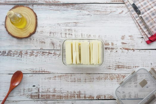 Slicing cheese into pieces closeup, ,