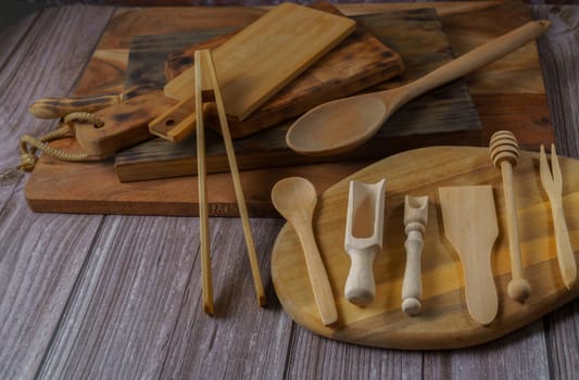 different types of wooden utensils used in the kitchen, boards and cutlery