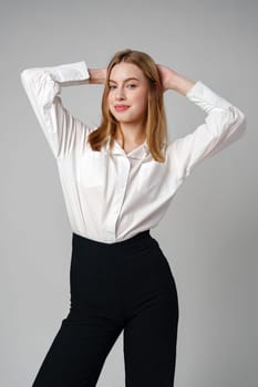 Young Woman in White Shirt Posing for Picture in studio
