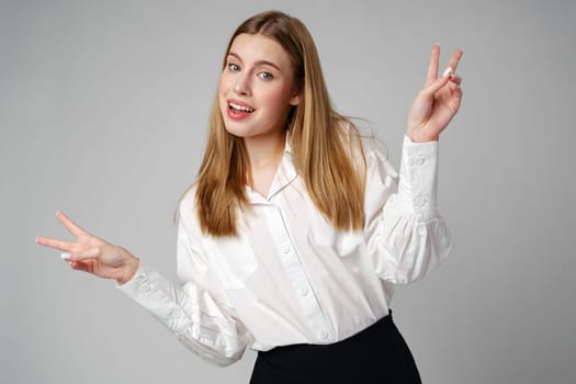 Young Woman Making Peace Sign With Fingers