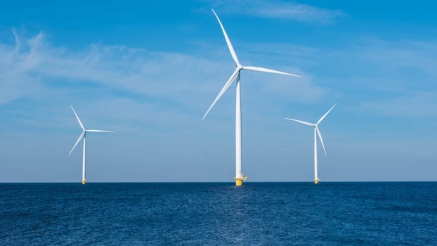 A cluster of wind turbines gracefully turning in the ocean, harnessing the power of the wind to generate renewable energy. Windmill turbines at sea, zero waste carbon neutral in Europe