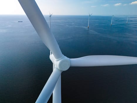 A mesmerizing view of windmill turbines generating clean energy in the vast expanse of the ocean, representing a harmonious blend of technology and nature.