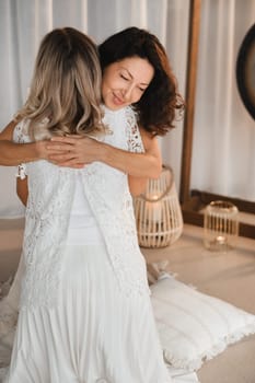 Two women hug at yoga. Women's Circle.