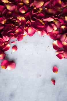 rose petals on marble flatlay - wedding, holiday and floral background styled concept, elegant visuals