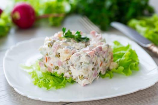 vegetable salad with boiled vegetables and dressed with mayonnaise .