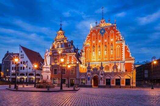 Riga Town Hall Square, House of the Blackheads and St. Roland Statue illuminated in the evening twilight, Riga, Latvia