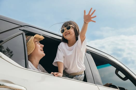 Happy family day. Asian Dad, mom and daughter little kid smiling sitting in compact car windows raise hand wave goodbye, Summer at beach, Car insurance, Family holiday vacation travel, road trip