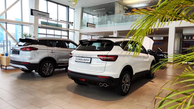 Cheboksary, Russia - March 20, 2023: Cars in showroom of dealership Chinese Car Manufacturer Geely. Sales Salon