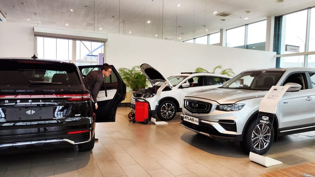 Cheboksary, Russia - March 20, 2023: Cars in showroom of dealership Chinese Car Manufacturer Geely. Sales Salon