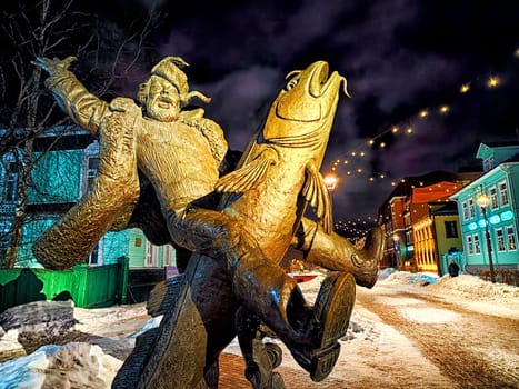 Arkhangelsk, Russia - February 28, 2024: Sculpture of Emel riding pike in winter in the city of Arkhangelsk. A Russian fairy tale