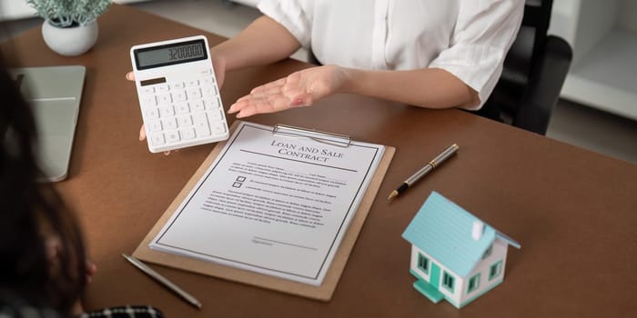 Real estate agent talking about the terms of the home purchase agreement and the customer to signing the documents to make the contract legally, Home sale and home insurance.