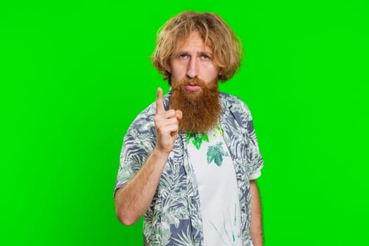 Quarrel. Displeased aggressive unhappy man gesturing hands with irritation and displeasure, blaming scolding for failure asking why this happened. Redhead bearded guy isolated on chroma key background