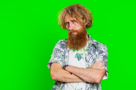 Offended sad nervous bearded man having misunderstanding, frustrated after quarrel, fail, lose, ignores and does not want to communicate, talk. Guy isolated on chroma key background. People lifestyles