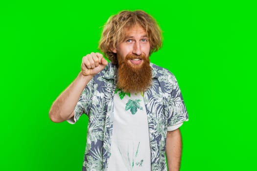 Knock-knock who is there. Confused excited young man knocking door gesture asking who is at home, feeling embarrassed, no idea, being clueless and uncertain. Guy isolated on chroma key background