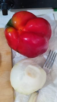 sweet red pepper, onion, fork, vegetables food. High quality photo