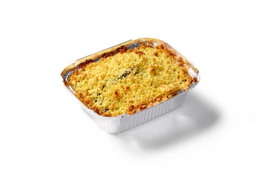 Delicious berry crumble pie with golden topping, baked to perfection and presented in disposable foil baking tray on white background