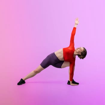 Full body length gaiety shot athletic and sporty woman doing healthy and meditative yoga exercise workout posture on isolated background. Healthy active and body care lifestyle