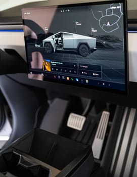Denver, Colorado, USA-May 5, 2024-The interior of a Tesla Cybertruck is highlighted in this image, showcasing the modern and minimalist dashboard with its large touchscreen display and distinctive steering yoke, providing a glimpse into the future of automotive design.