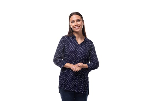 young stylish cute european slim business woman with straight black hair dressed in dark blue blouse.