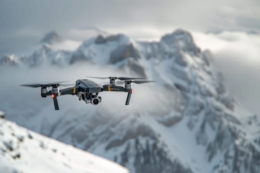 A drone is flying over a snowy mountain range. The sky is cloudy and the sun is setting, creating a serene and peaceful atmosphere