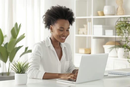 A woman is sitting at a desk with a laptop in front of her. She is smiling and she is enjoying her work. The room is decorated with plants and books, creating a cozy and comfortable atmosphere