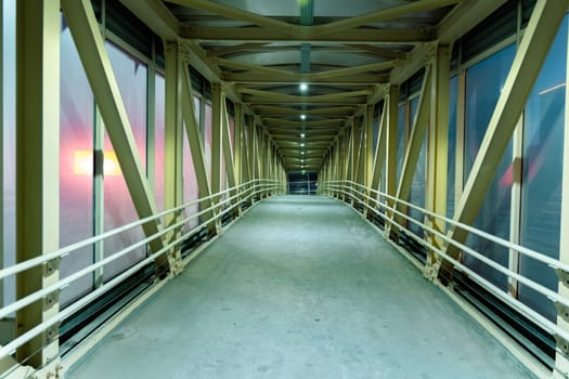 Illuminated Corridor Through the Modern Pedestrian Passage at Dusk
