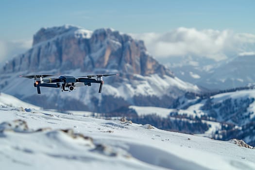 A drone is flying over a snowy mountain range. The sky is cloudy and the sun is setting, creating a serene and peaceful atmosphere