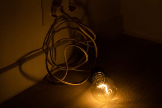 a light bulb with the cord lit